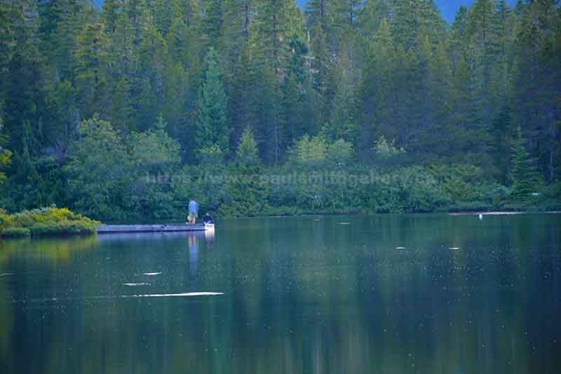 photo of a couple fisherman fishing in Star Lake near Gold River on Vancouver Island 