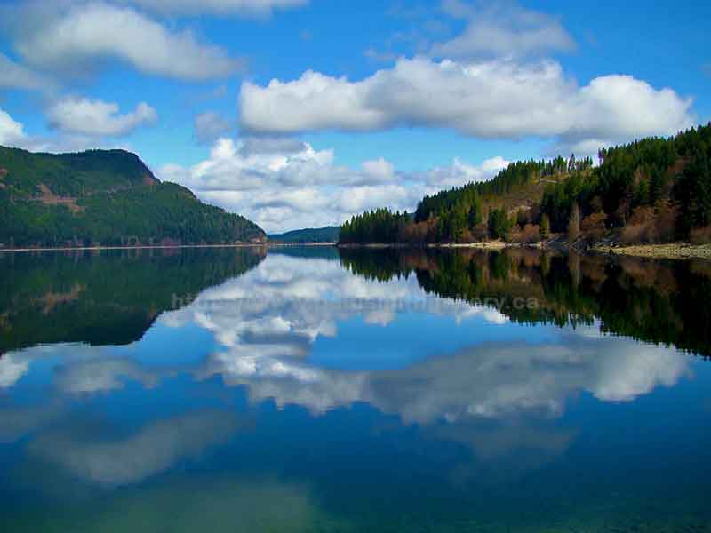 photo of the reflection of clouds on Upper Campbell Lake on Vancouver Island