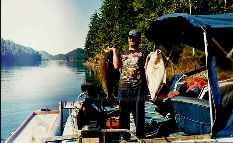 photo of an anger with two nice halibut in Nootka Sound